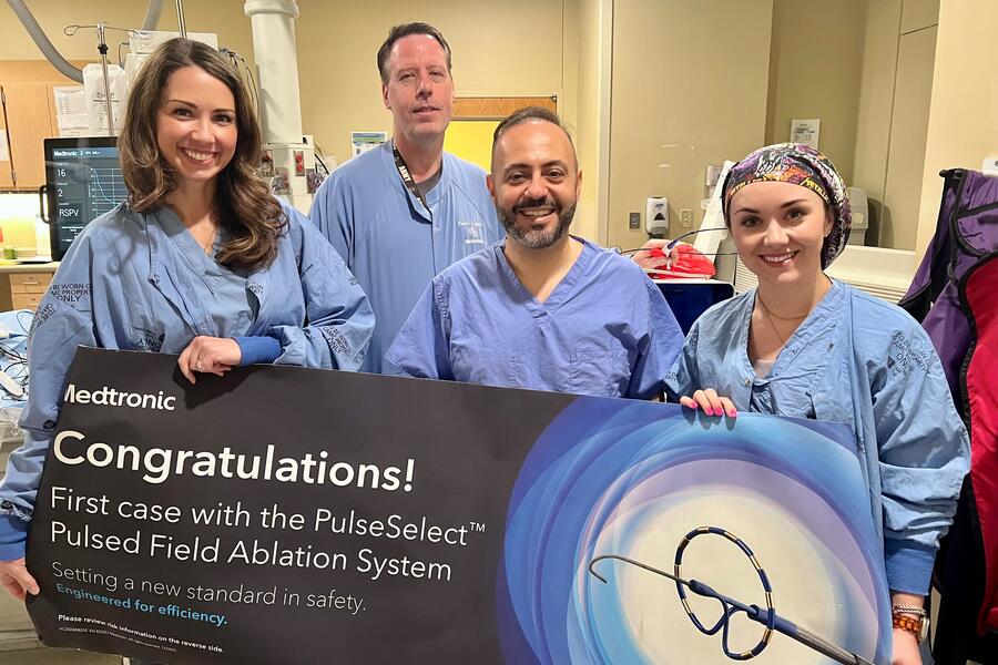 Cardiology team holding banner: Congratulations