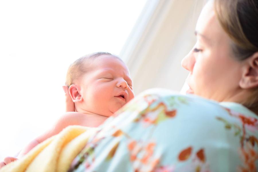 Mother looking at newborn baby