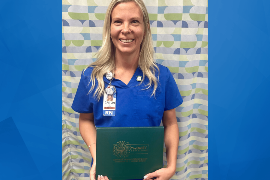 An image of Caitlin Jackfert holding her award.